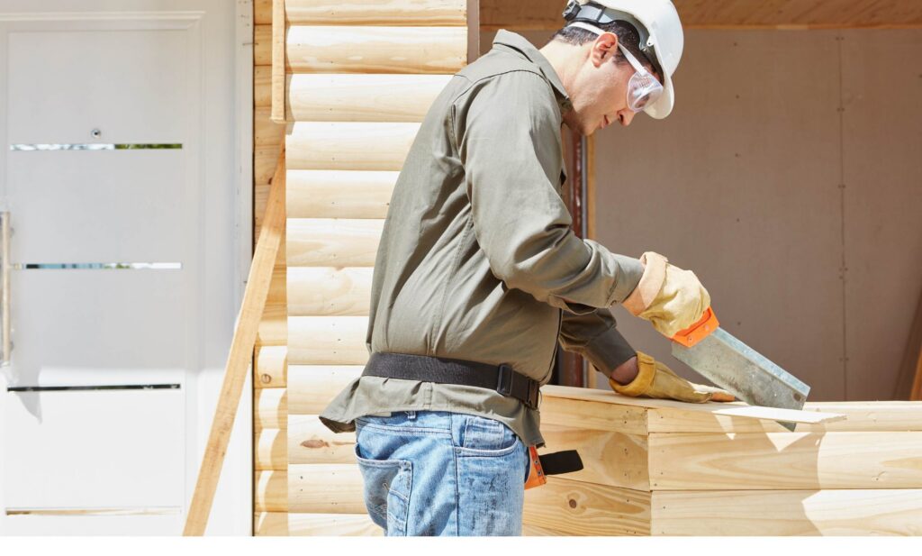 Artisan du bâtiment au travail sur un chantier avec ses outils